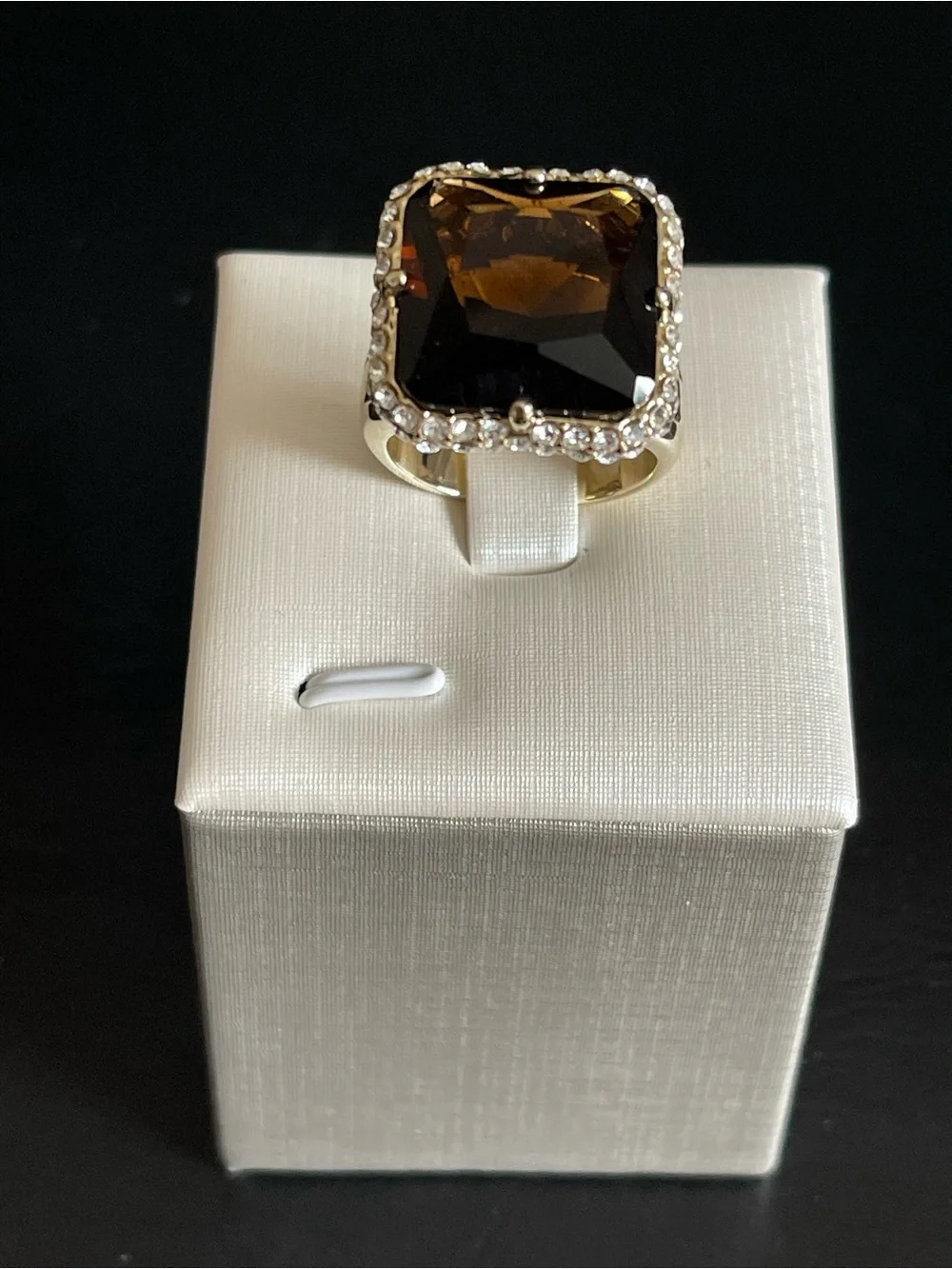 New gold tone simulated smoky quartz ring.